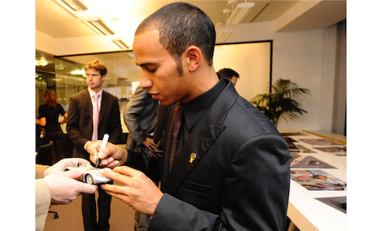 Lewis Hamilton signs miniature Mercedes