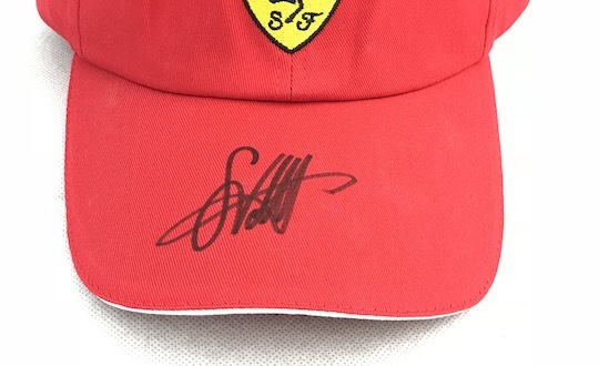 Original signed Ferrari Cap by Sebastian Vettel