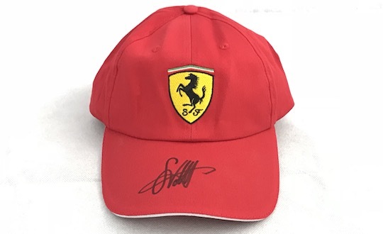 Original signed Ferrari Cap by Sebastian Vettel