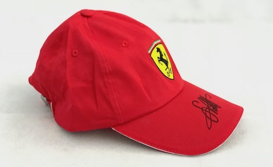Original signed Ferrari Cap by Sebastian Vettel