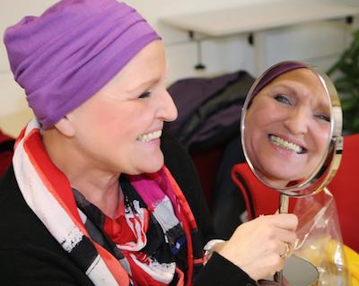 Aid organisation DKMS LIFE - cancer patient with headgear