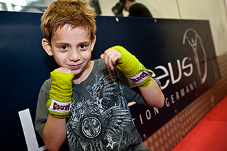 Little boy during boxing training
